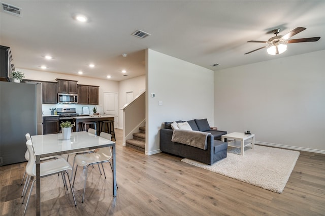 2016 Saddle Way, Mesquite, TX 75149 - dining space featuring stairs, a ceiling fan, wood finished floors, and recessed lighting