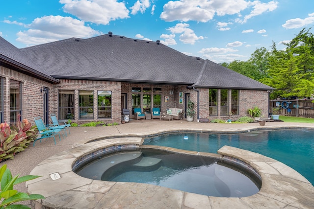 3231 Mccarver Ct, Midlothian, TX 76065 - view of swimming pool featuring a patio area, a pool with connected hot tub, and outdoor lounge area