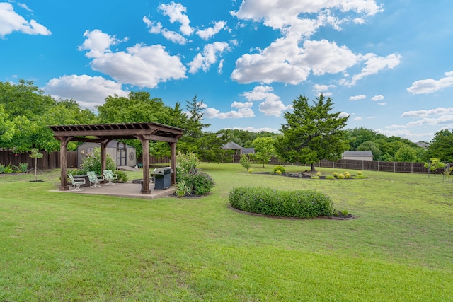 3231 Mccarver Ct, Midlothian, TX 76065 - fenced backyard with a patio, a pergola, and a storage unit
