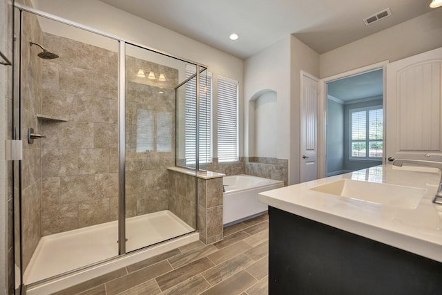 15005 Teasley Ave, Aledo, TX 76008 - full bath featuring a garden tub, a stall shower, vanity, recessed lighting, and wood tiled floors