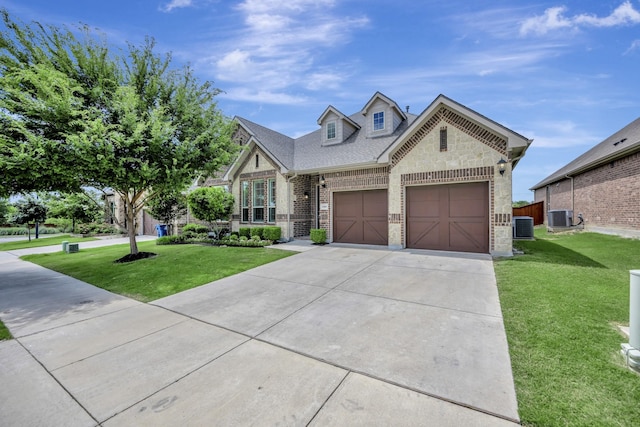 15005 Teasley Ave, Aledo, TX 76008 - view of front of property with brick siding, a front lawn, concrete driveway, a garage, and stone siding