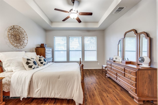 3504 Brookside Dr, Wylie, TX 75098 - bedroom with a raised ceiling, wood finished floors, and ceiling fan