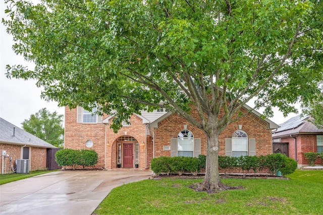 3504 Brookside Dr, Wylie, TX 75098 - view of front facade with brick siding, concrete driveway, and a front lawn