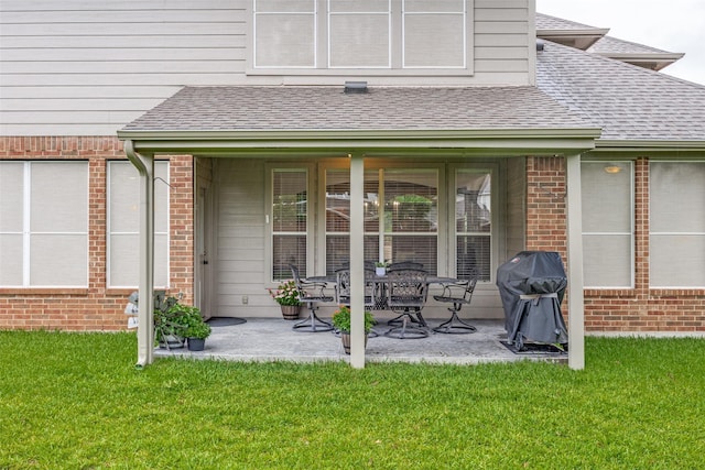 3504 Brookside Dr, Wylie, TX 75098 - back of property featuring roof with shingles, brick siding, and a lawn