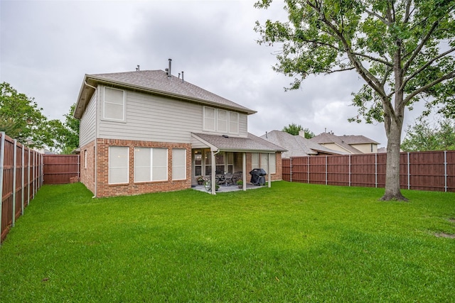 3504 Brookside Dr, Wylie, TX 75098 - rear view of property with brick siding, a fenced backyard, and a patio area
