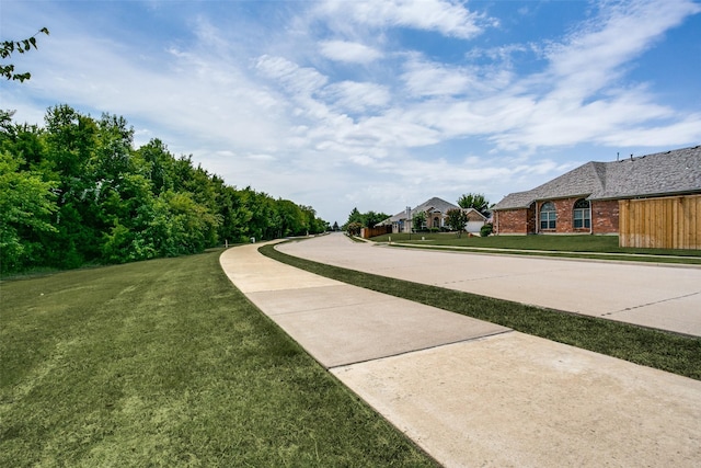 3504 Brookside Dr, Wylie, TX 75098 - view of concrete road featuring sidewalks