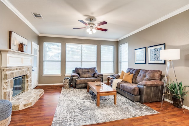 3504 Brookside Dr, Wylie, TX 75098 - living area with ceiling fan, crown molding, dark wood-type flooring, and a fireplace