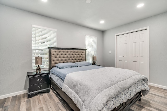 2203 Loyce Dr, Mesquite, TX 75149 - bedroom with light wood-type flooring, a closet, and recessed lighting