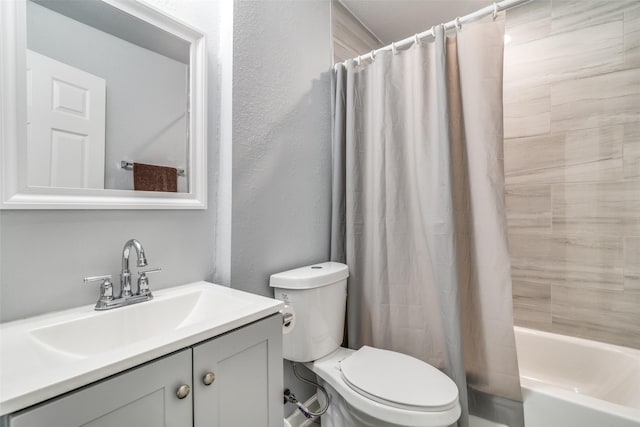 2203 Loyce Dr, Mesquite, TX 75149 - full bathroom with vanity, shower / bathtub combination with curtain, and a textured wall