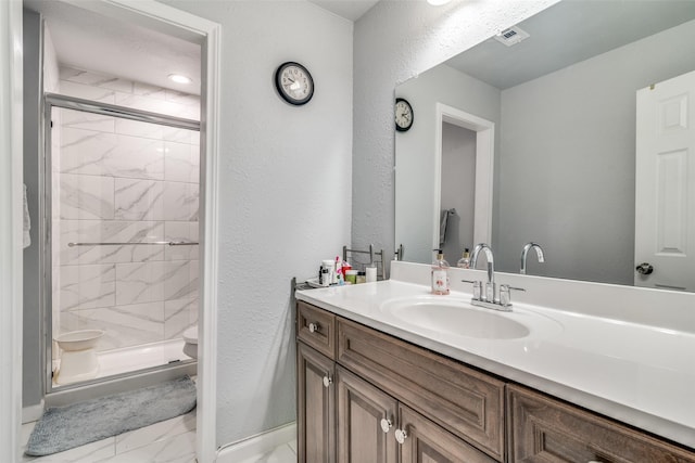 2203 Loyce Dr, Mesquite, TX 75149 - bathroom with marble look tiles, vanity, and a shower stall