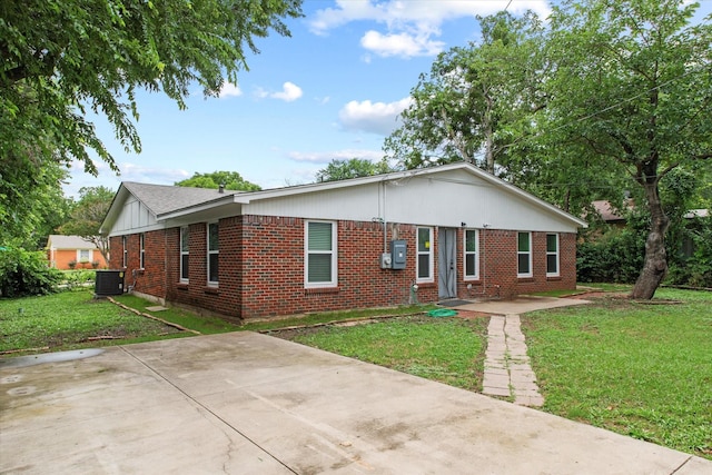2203 Loyce Dr, Mesquite, TX 75149 - view of front facade featuring brick siding, a front lawn, and a patio area