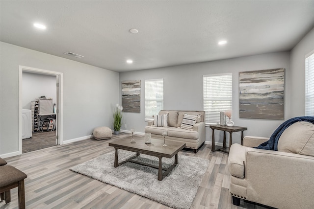2203 Loyce Dr, Mesquite, TX 75149 - living room featuring light wood-style floors and recessed lighting