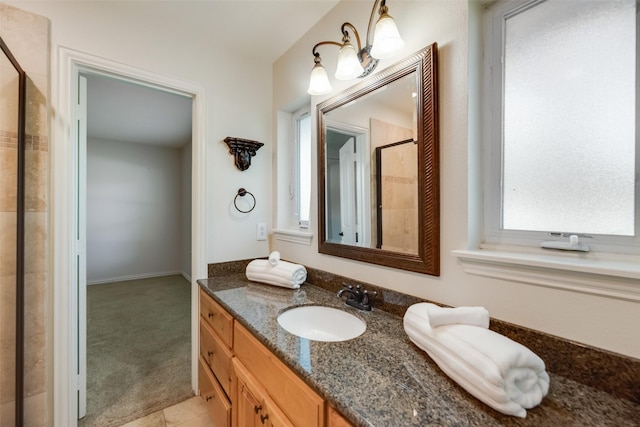 5820 Forest Ln, Dallas, TX 75230 - full bath featuring a stall shower, vanity, and tile patterned flooring