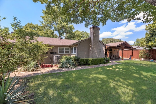 5820 Forest Ln, Dallas, TX 75230 - back of house with a patio and a chimney
