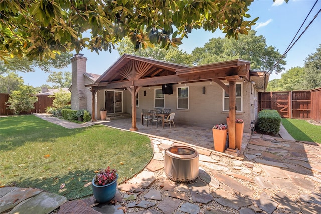5820 Forest Ln, Dallas, TX 75230 - rear view of property with a chimney, a fenced backyard, a patio, a gate, and brick siding