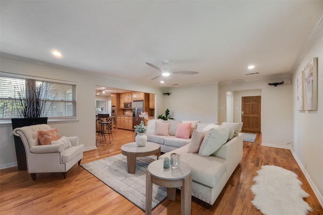 5820 Forest Ln, Dallas, TX 75230 - living room featuring crown molding, ceiling fan, light wood finished floors, and recessed lighting