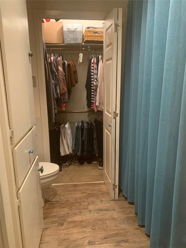8918 Bellechase Rd, Granbury, TX 76049 - bathroom with wood finished floors and a spacious closet