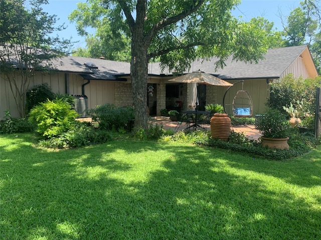 8918 Bellechase Rd, Granbury, TX 76049 - view of front of property featuring a front lawn, roof with shingles, and a patio