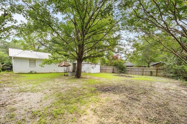 115 Red Bud Rd, Gun Barrel City, TX 75156 - fenced backyard with a storage unit