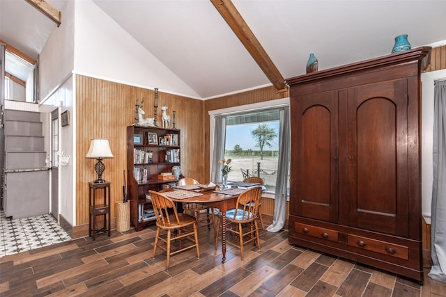 2473 Oil, City, Wilson, OK 73463 - dining space featuring dark wood finished floors, beamed ceiling, wood walls, and high vaulted ceiling