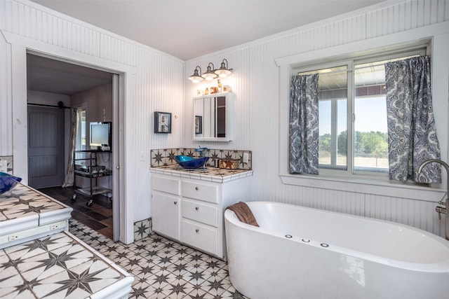 2473 Oil, City, Wilson, OK 73463 - bathroom with tile patterned floors, vanity, and a freestanding bath