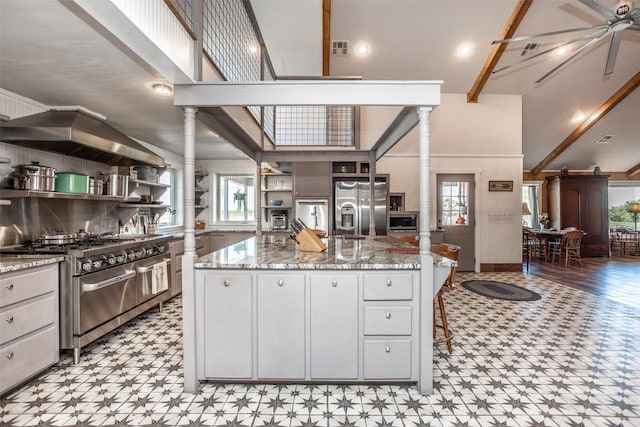 2473 Oil, City, Wilson, OK 73463 - kitchen with stainless steel appliances, decorative columns, light flooring, and plenty of natural light