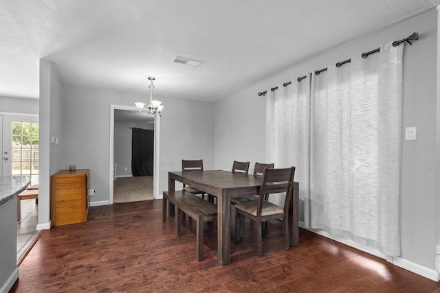 4933 N Colony Blvd, The Colony, TX 75056 - dining area featuring wood finished floors and a chandelier