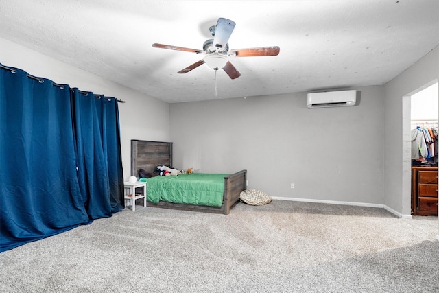 4933 N Colony Blvd, The Colony, TX 75056 - carpeted bedroom featuring a wall unit AC and a ceiling fan