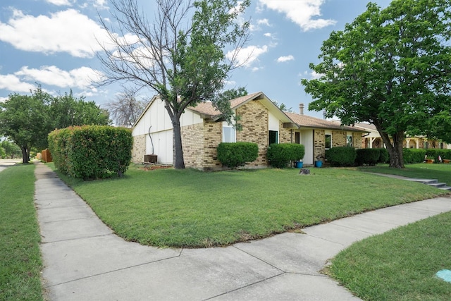 4933 N Colony Blvd, The Colony, TX 75056 - view of front of property with brick siding and a front yard