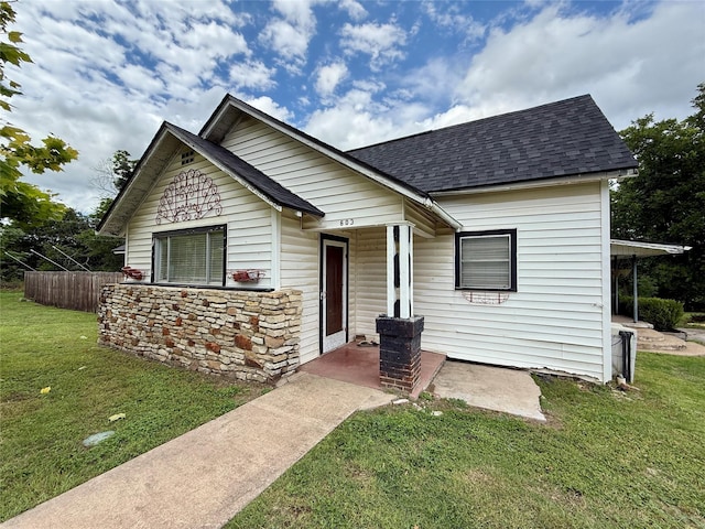 603 N Mesquite St, Hico, TX 76457 - bungalow-style house featuring roof with shingles, a front lawn, and a porch