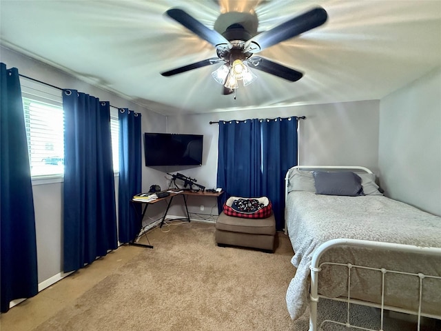 603 N Mesquite St, Hico, TX 76457 - carpeted bedroom featuring baseboards and ceiling fan