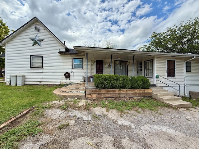 603 N Mesquite St, Hico, TX 76457 - view of front of house featuring covered porch and a front yard