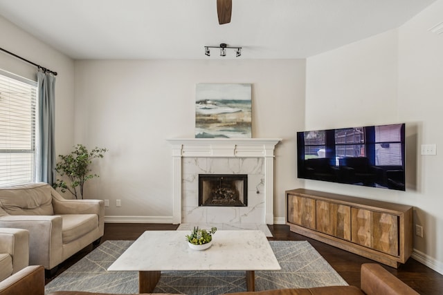 7105 Stoneridge Dr, Frisco, TX 75034 - living room with wood finished floors, ceiling fan, and a premium fireplace