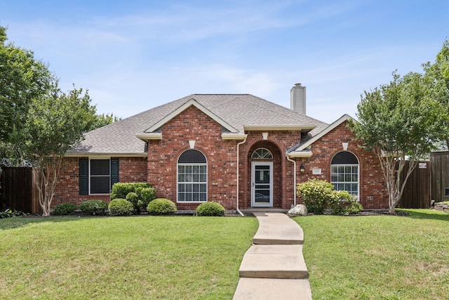 7105 Stoneridge Dr, Frisco, TX 75034 - traditional home featuring brick siding, a chimney, and a shingled roof