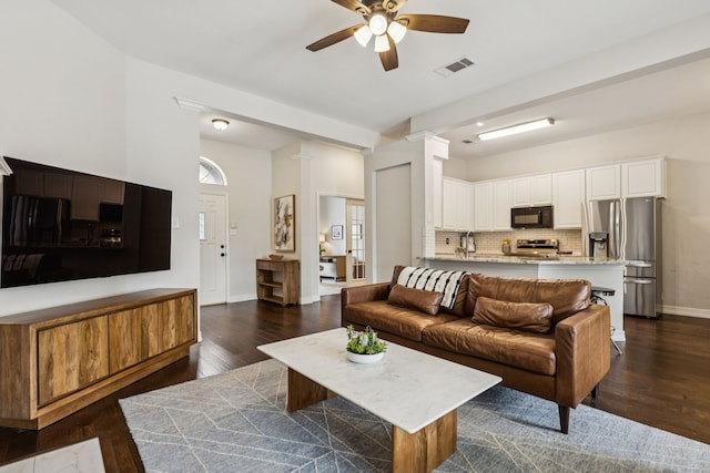 7105 Stoneridge Dr, Frisco, TX 75034 - living area featuring a ceiling fan and dark wood-style flooring