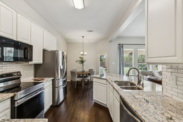 7105 Stoneridge Dr, Frisco, TX 75034 - kitchen with stainless steel appliances, backsplash, dark wood-style flooring, and white cabinets