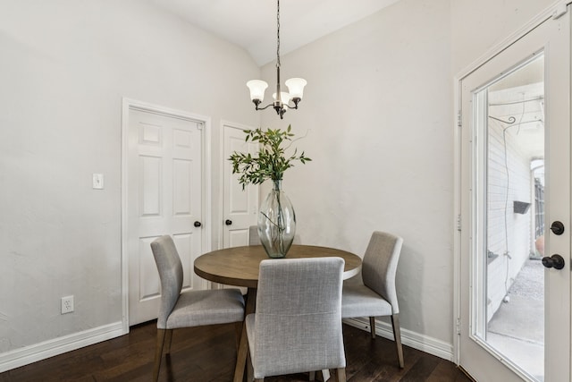 7105 Stoneridge Dr, Frisco, TX 75034 - dining area featuring a chandelier, dark wood-style flooring, and lofted ceiling