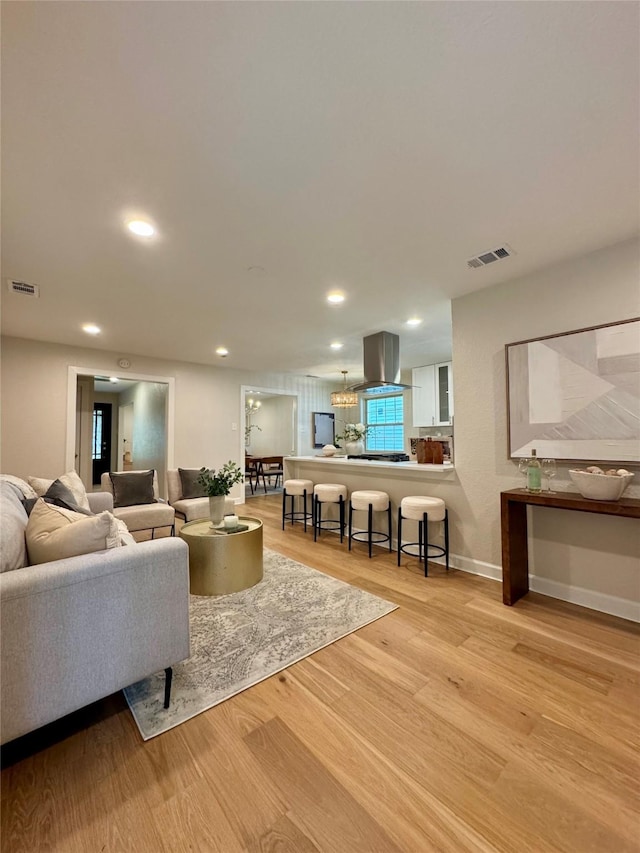 10017 Lanshire Dr, Dallas, TX 75238 - living room featuring light wood-style flooring and recessed lighting
