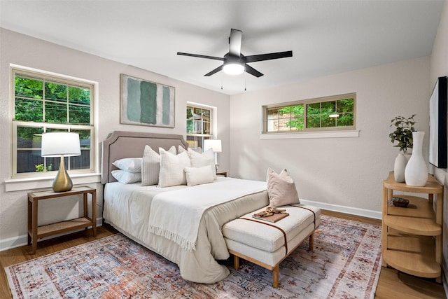10017 Lanshire Dr, Dallas, TX 75238 - bedroom featuring wood finished floors and ceiling fan