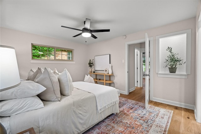 10017 Lanshire Dr, Dallas, TX 75238 - bedroom featuring light wood-type flooring and a ceiling fan