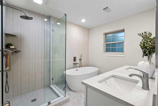 10017 Lanshire Dr, Dallas, TX 75238 - bathroom with a shower stall, double vanity, and a soaking tub