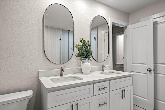 10017 Lanshire Dr, Dallas, TX 75238 - full bath featuring double vanity and a textured wall