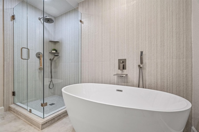10017 Lanshire Dr, Dallas, TX 75238 - full bath featuring a soaking tub and a stall shower