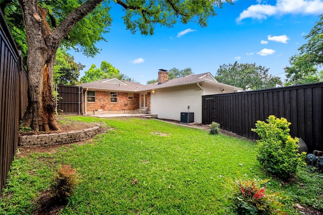 10017 Lanshire Dr, Dallas, TX 75238 - rear view of house with a chimney, a patio, a fenced backyard, and brick siding