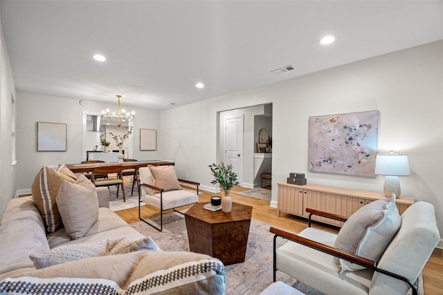 10017 Lanshire Dr, Dallas, TX 75238 - living room featuring a chandelier, light wood-style flooring, and recessed lighting