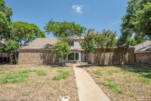 4209 Brooktree Ln, Dallas, TX 75287 - view of front facade featuring brick siding and a chimney