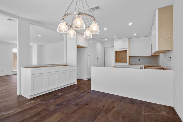 4209 Brooktree Ln, Dallas, TX 75287 - kitchen featuring a chandelier, dark wood finished floors, white cabinets, recessed lighting, and a peninsula