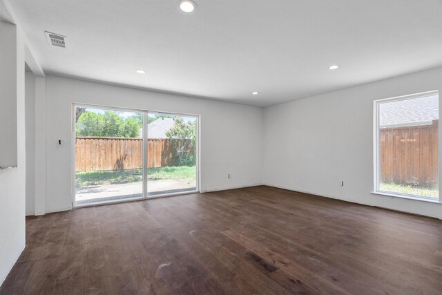 4209 Brooktree Ln, Dallas, TX 75287 - unfurnished room with dark wood-type flooring and recessed lighting