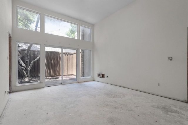 4209 Brooktree Ln, Dallas, TX 75287 - unfurnished room featuring concrete flooring and a high ceiling