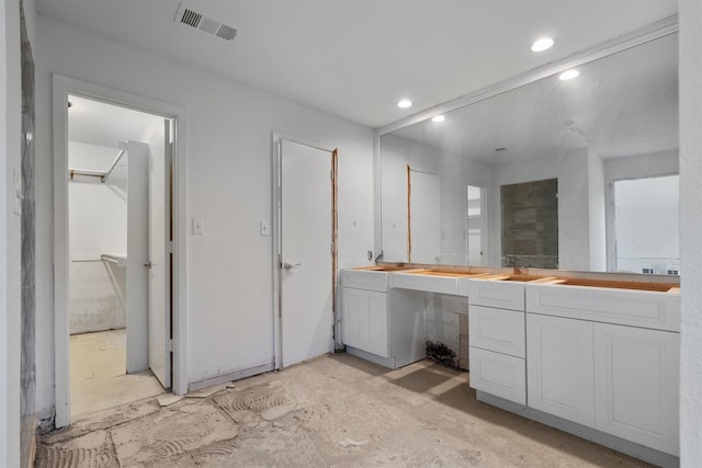 4209 Brooktree Ln, Dallas, TX 75287 - bathroom with double vanity, recessed lighting, and a shower